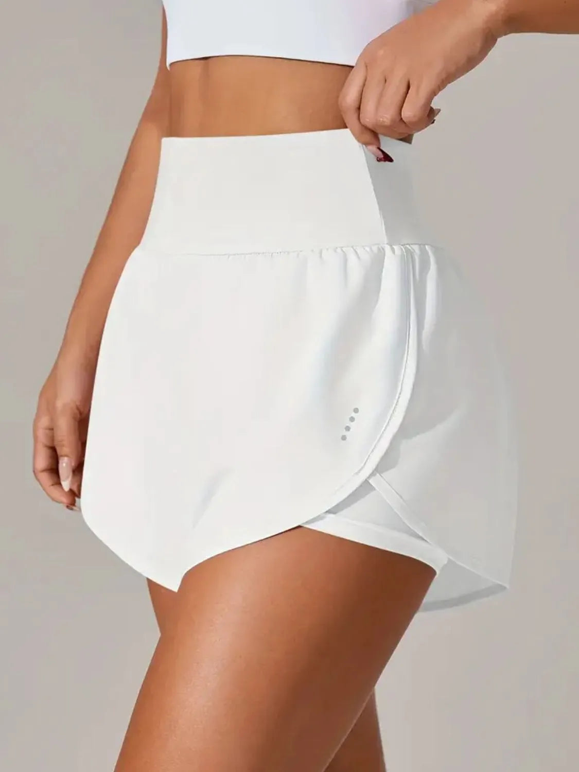 White athletic skirt worn by a person on NEWYORKLISTED.COM