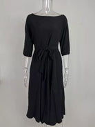 NEWYORKLISTED STYLE COLLECTION: Black dress on a mannequin against a white background