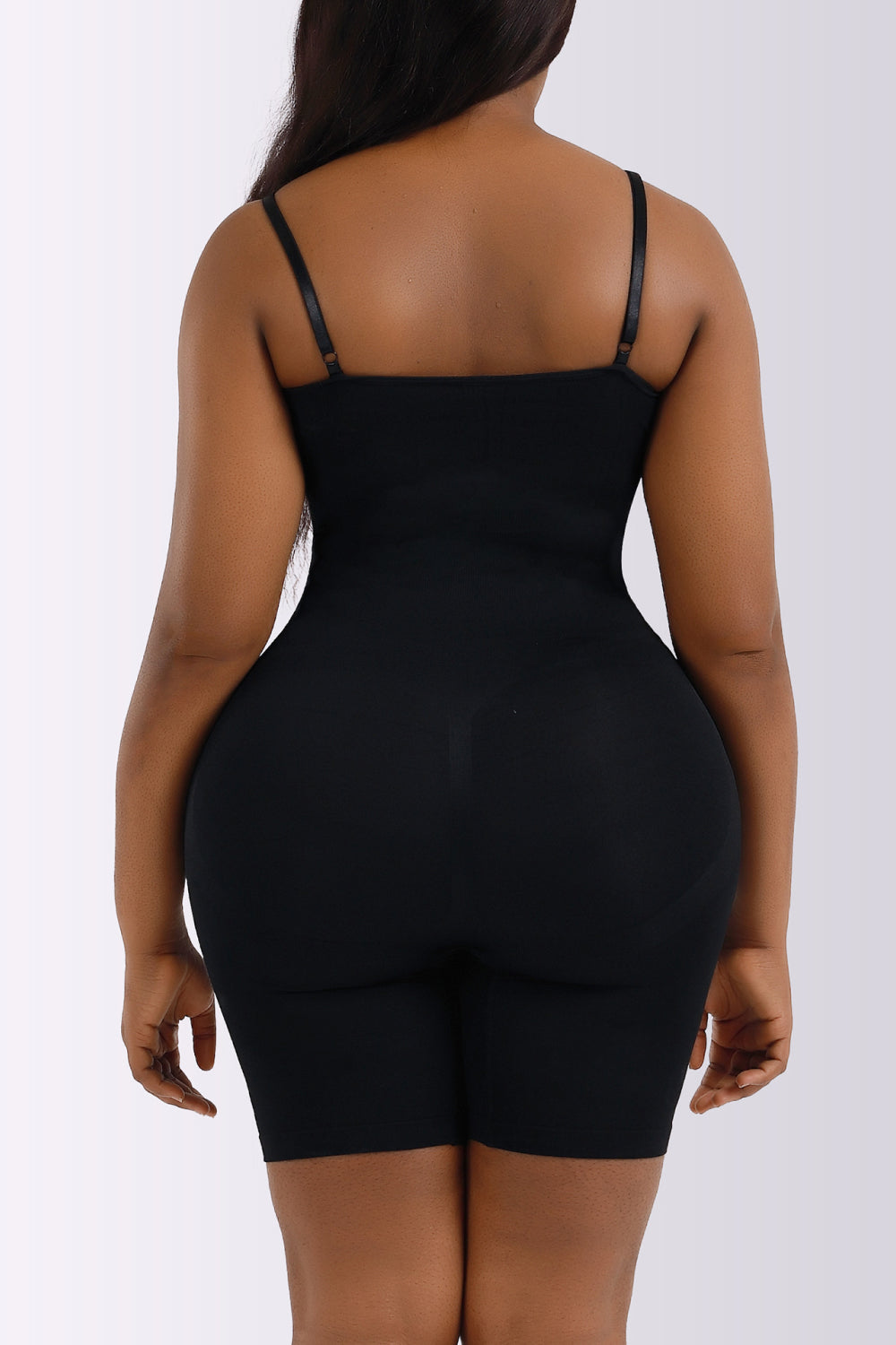 NEWYORKLISTED Intimate Apparel Collection: Black shapewear garment worn by a model on a white background