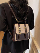 NEWYORKLISTED STYLE COLLECTION: Person wearing a brown and beige backpack indoors
