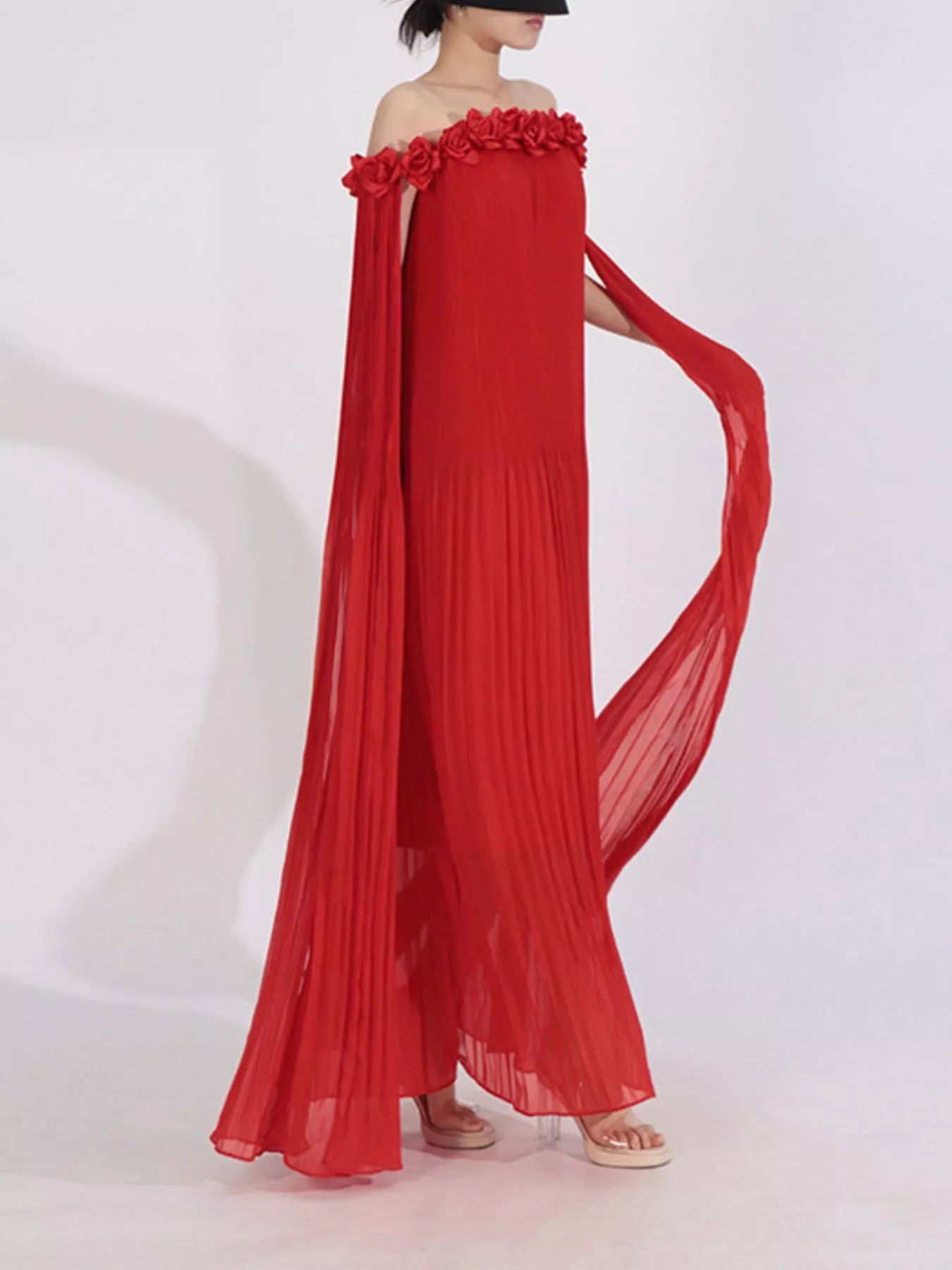 NEWYORKLISTED STYLE COLLECTION: Red off-shoulder dress with floral details on a white background 