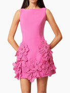 NEWYORKLISTED STYLE COLLECTION: Pink dress with floral embellishments on a white background