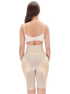 NEWYORKLISTED Intimate Apparel: Woman wearing a beige shapewear garment on a white background