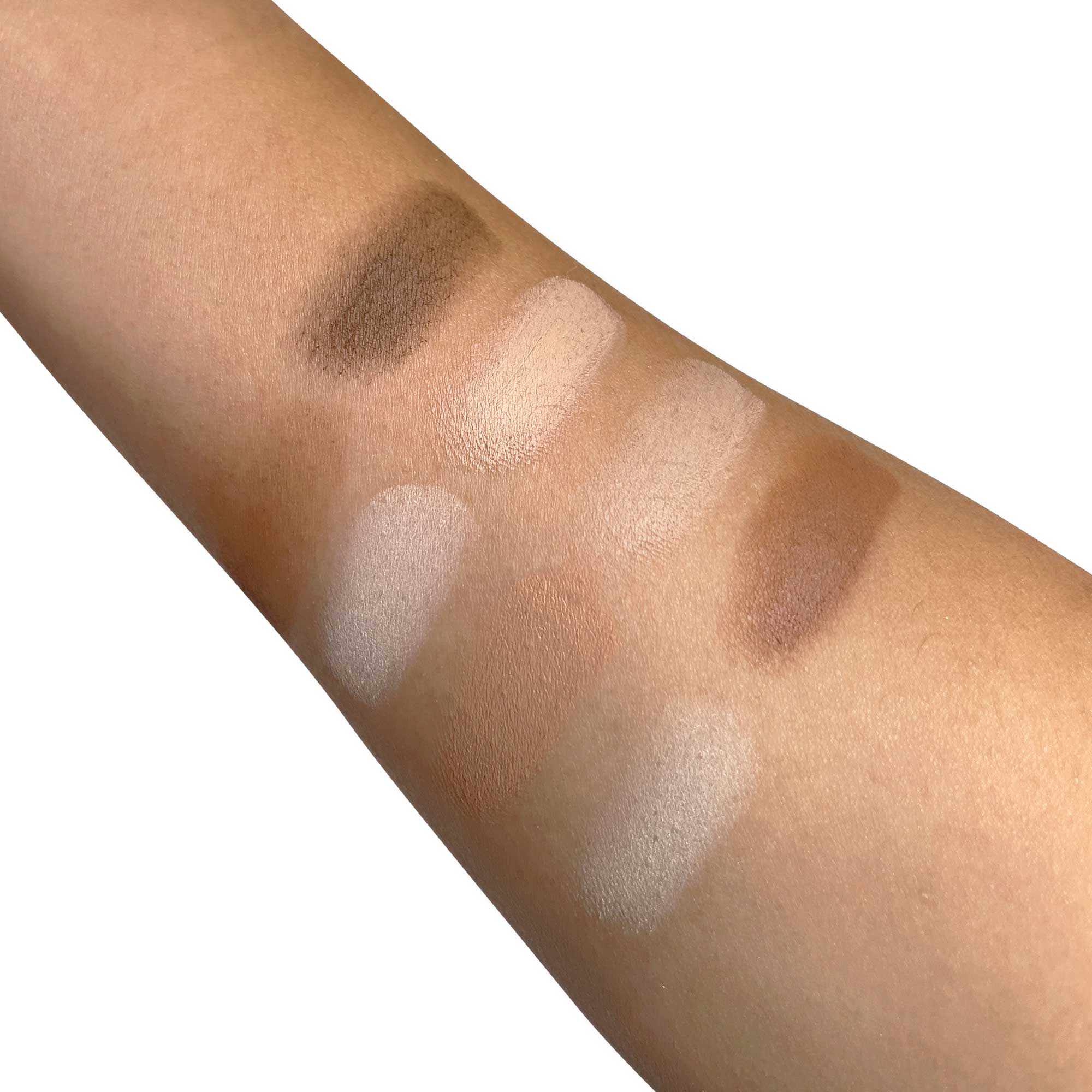 NEWYORKLISTED Cosmetic Collection: Ultimate Contour Color swatches on a person's arm with various shades of brown and beige.