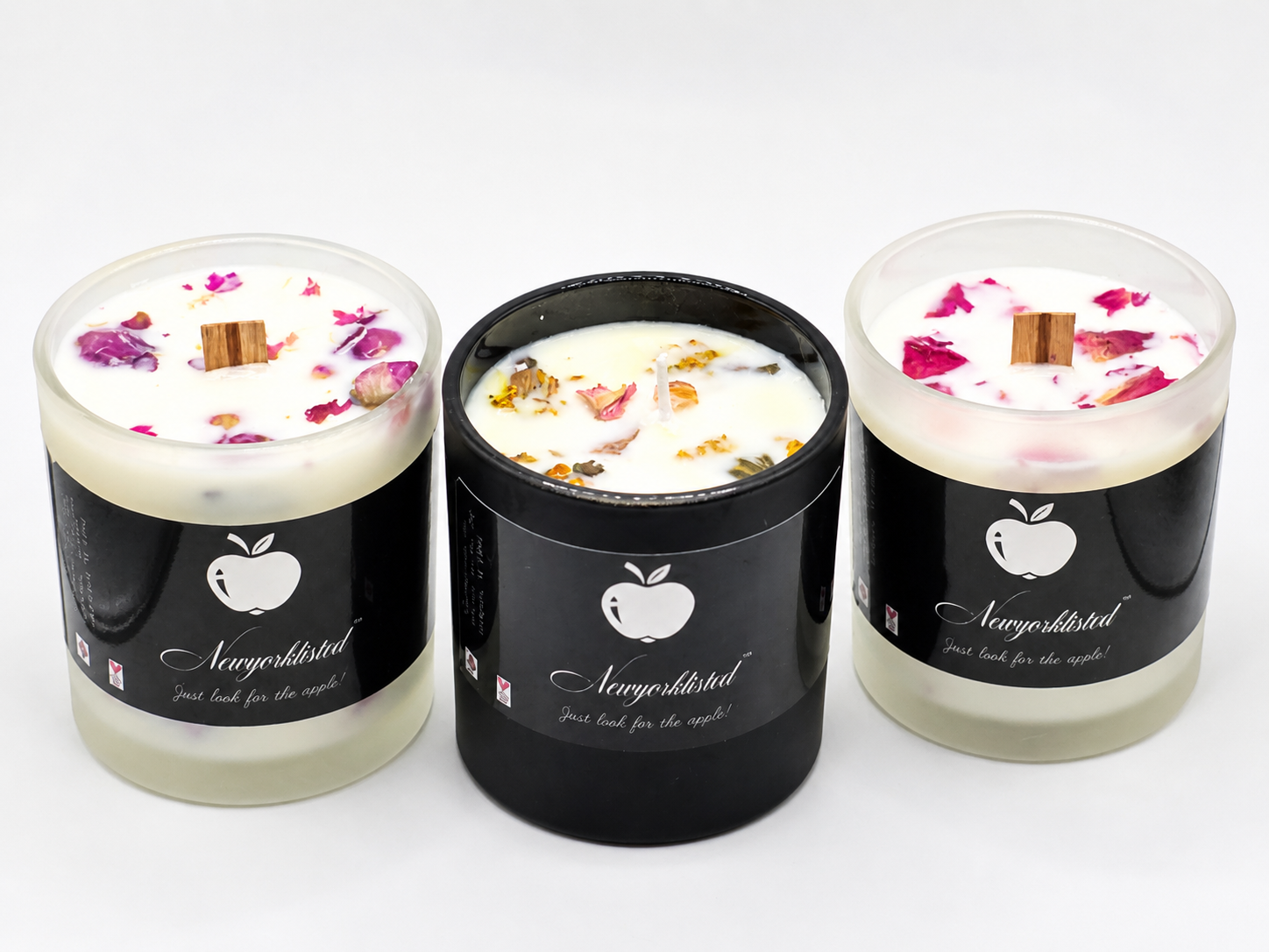 NEWYORKLISTED LUXURY SENSORY COLLECTION™: Botanical Wood Wick Candle – Hand-Poured Luxury Spa Candle: Three candles with decorative elements in black containers on a white background