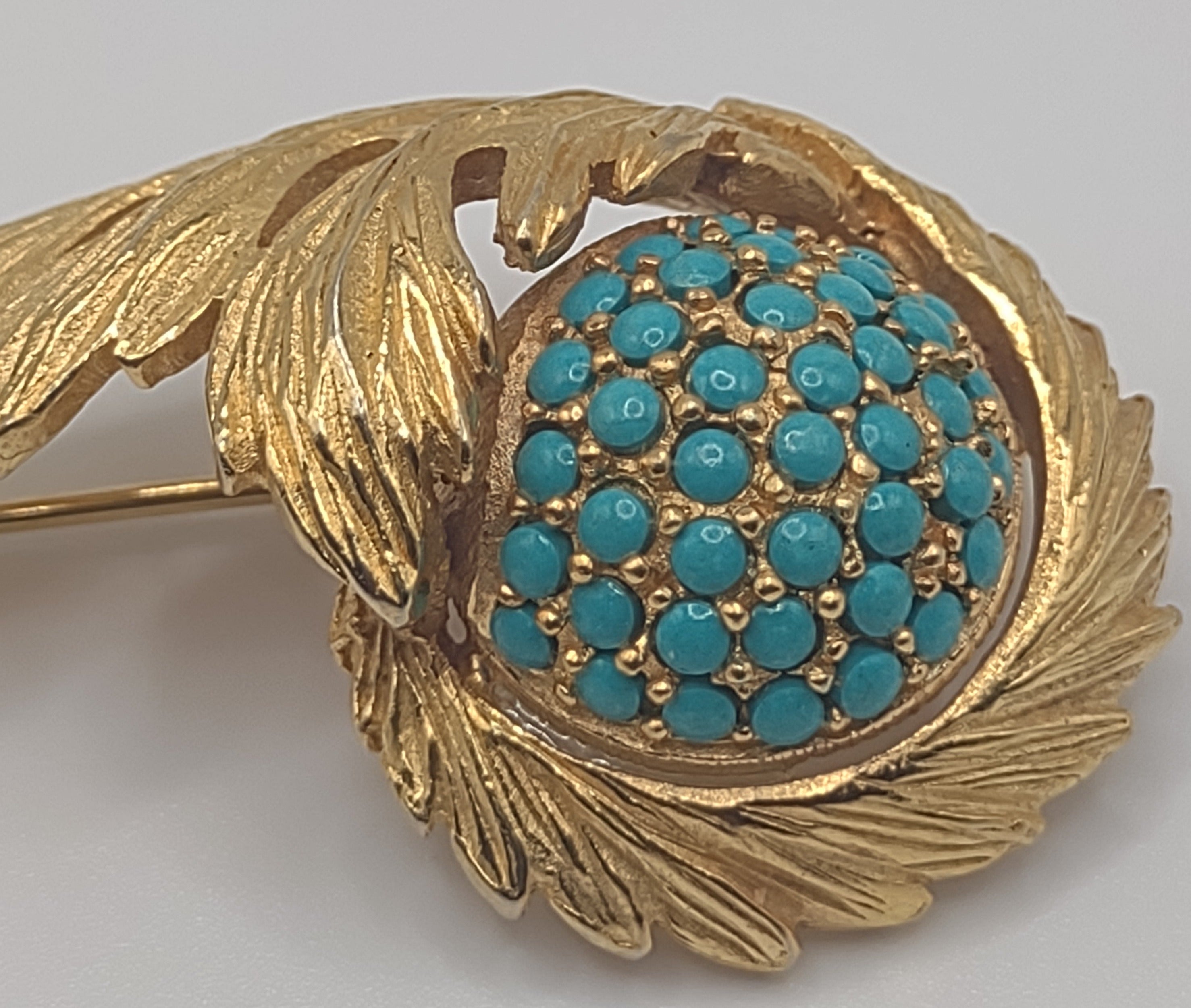 Hattie Carnegie Broach with simulated turquoise beading in gold tone