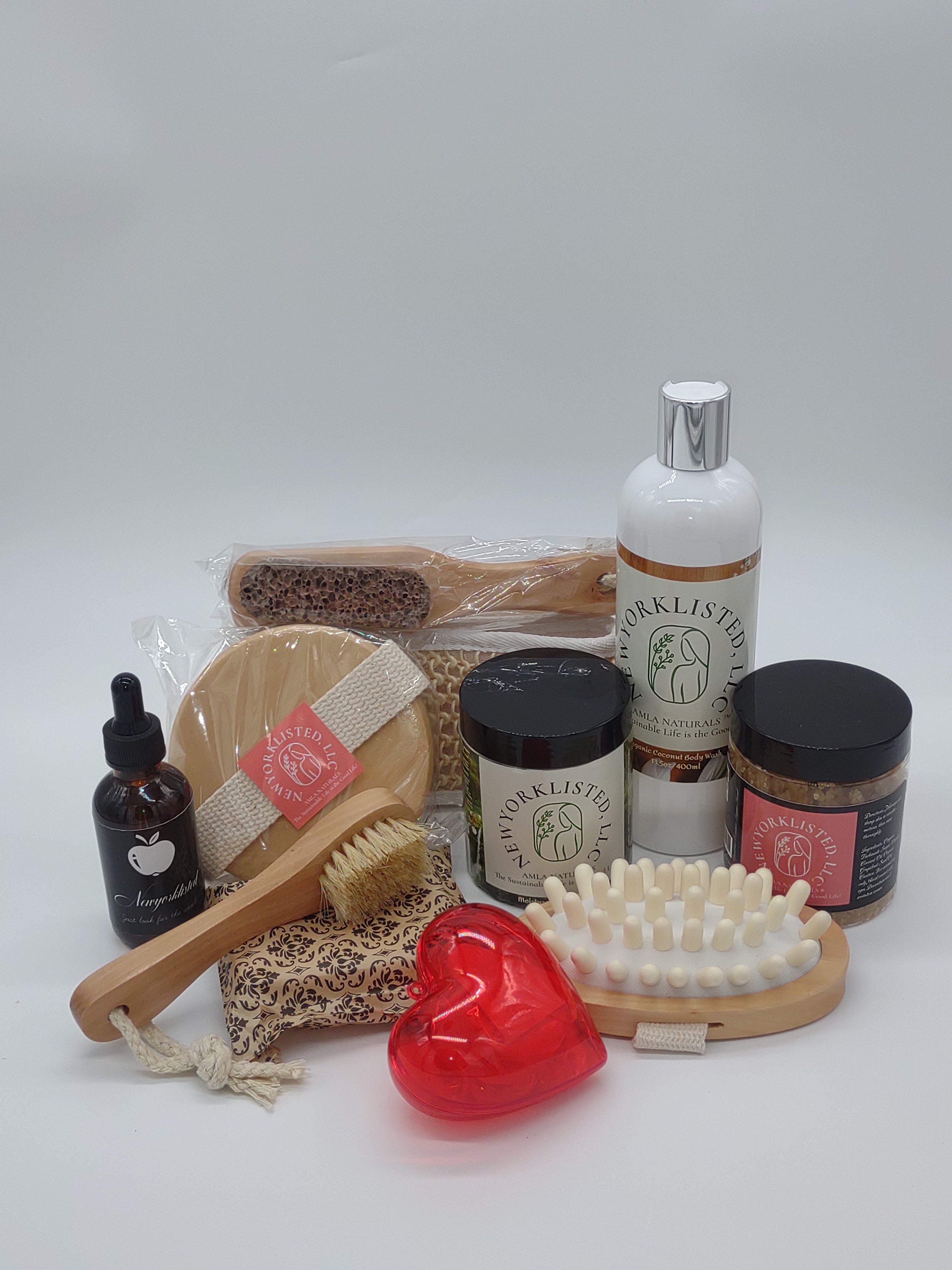 NEWYORKLISTED Valentine’s Day Luxury Spa Gift Basket, Collection of natural skincare and cleaning products on a white background
