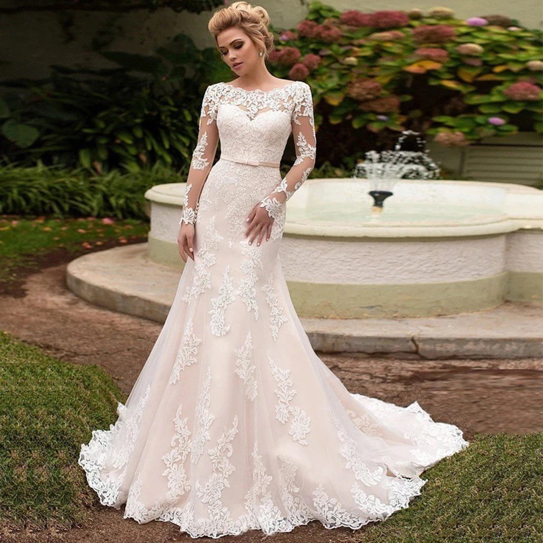 Backless long sleeve lace wedding dress with O-neckline and court train from NEWYORKLISTED Elegant Bride Collection.