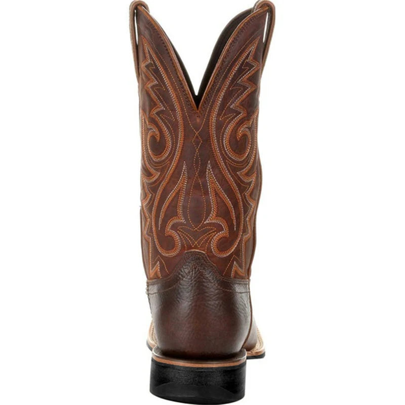 NEWYORKLISTED ATLAS MEN'S COLLECTION: Brown cowboy boot with intricate leatherwork on a white background