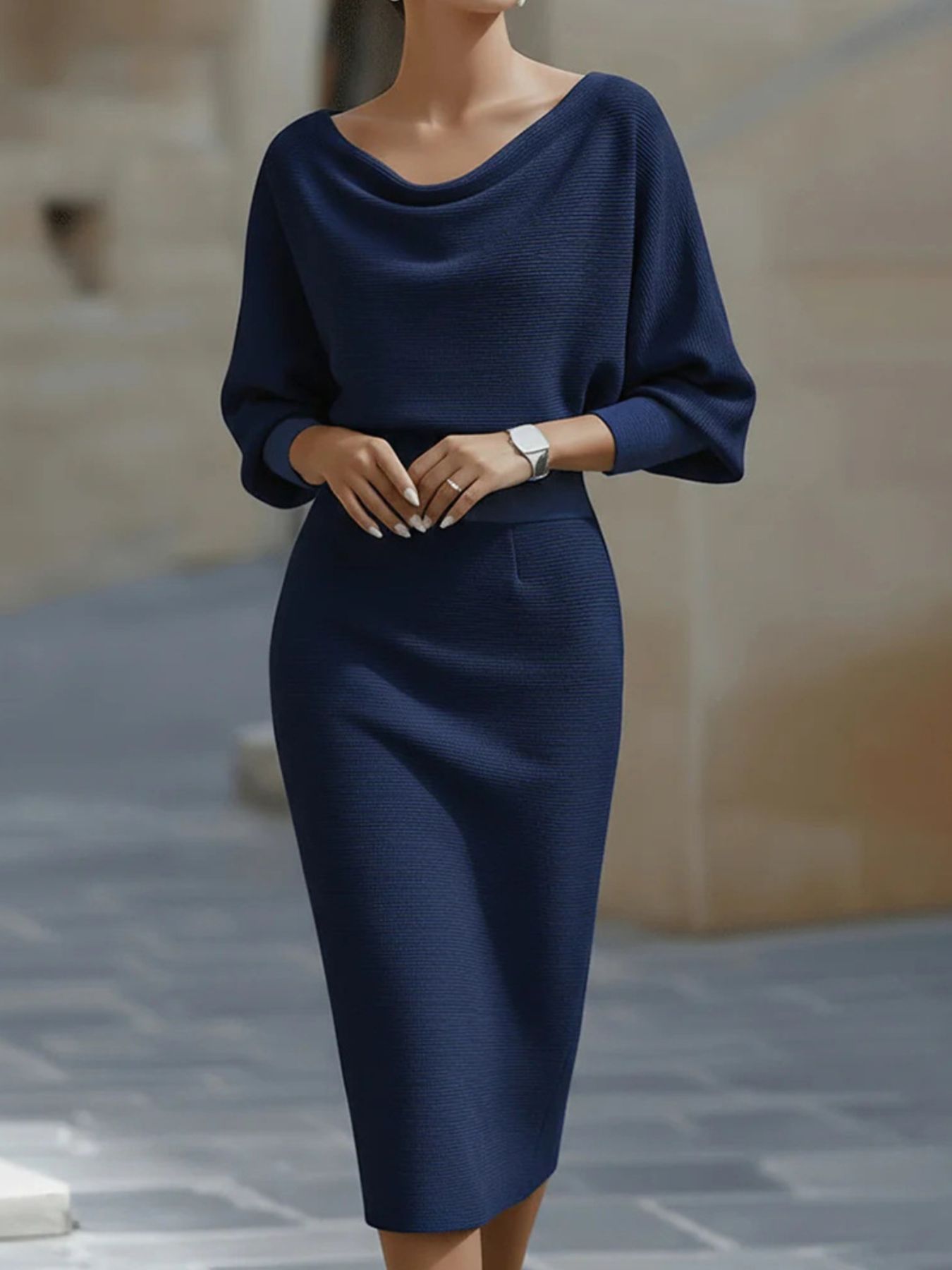 Woman wearing NEWYORKLISTED cowl neck knit bodycon dress in soft stretch cotton with sleeveless fitted midi silhouette.