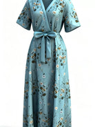 NEWYORKLISTED STYLE COLLECTION: Light blue floral dress with a bow on a white background