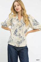NEWYORKLISTED STYLE COLLECTION: Umgee Floral Embroidered Blouse with Ruffle Trim – Romantic Button-Front Top: Woman wearing a floral blouse with puff sleeves against a white background