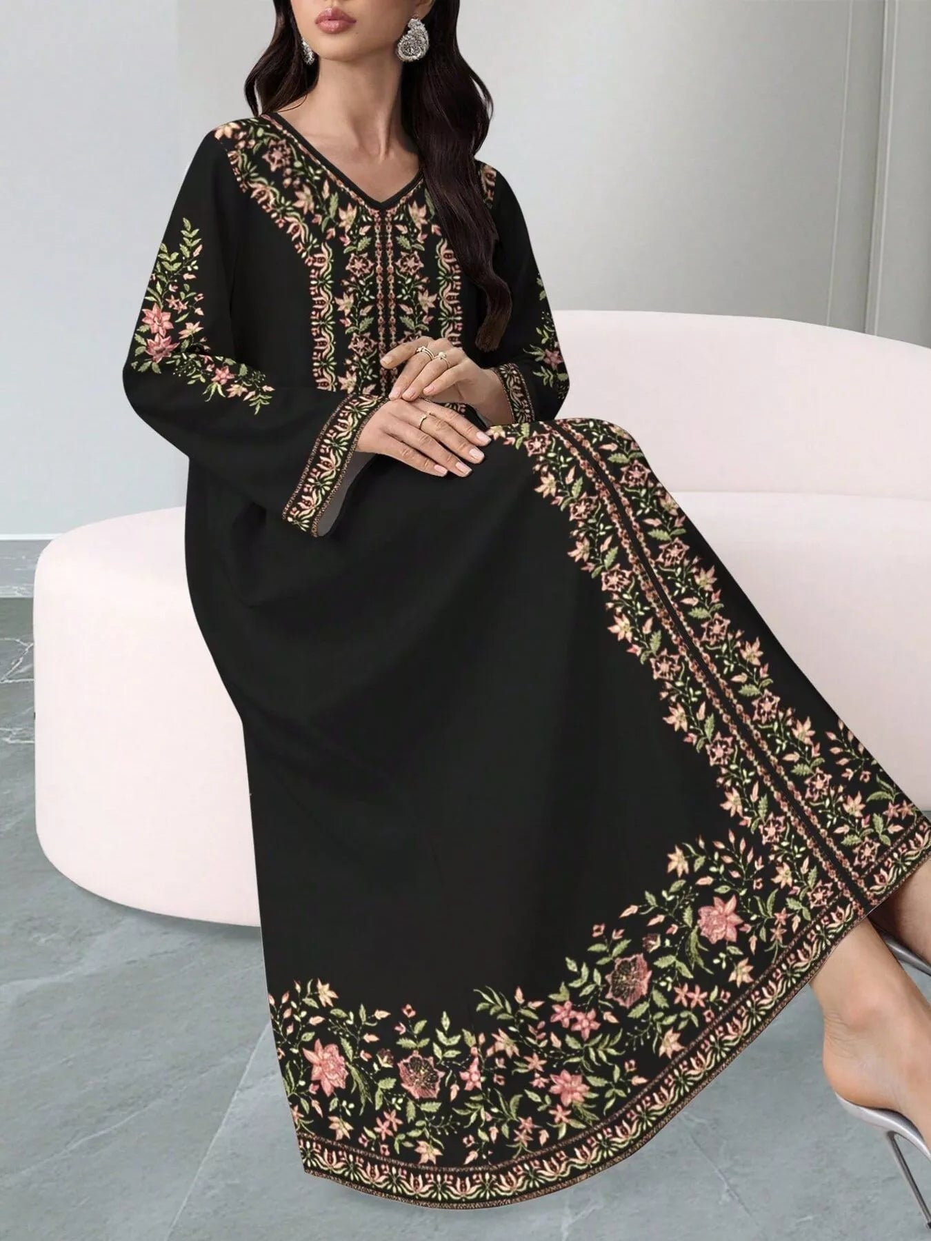 NEWYORKLISTED STYLE COLLECTION: Black dress with floral embroidery on a white chair