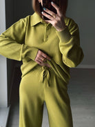 NEWYORKLISTED Comfort Collection: Person wearing a green knit outfit with a plain background