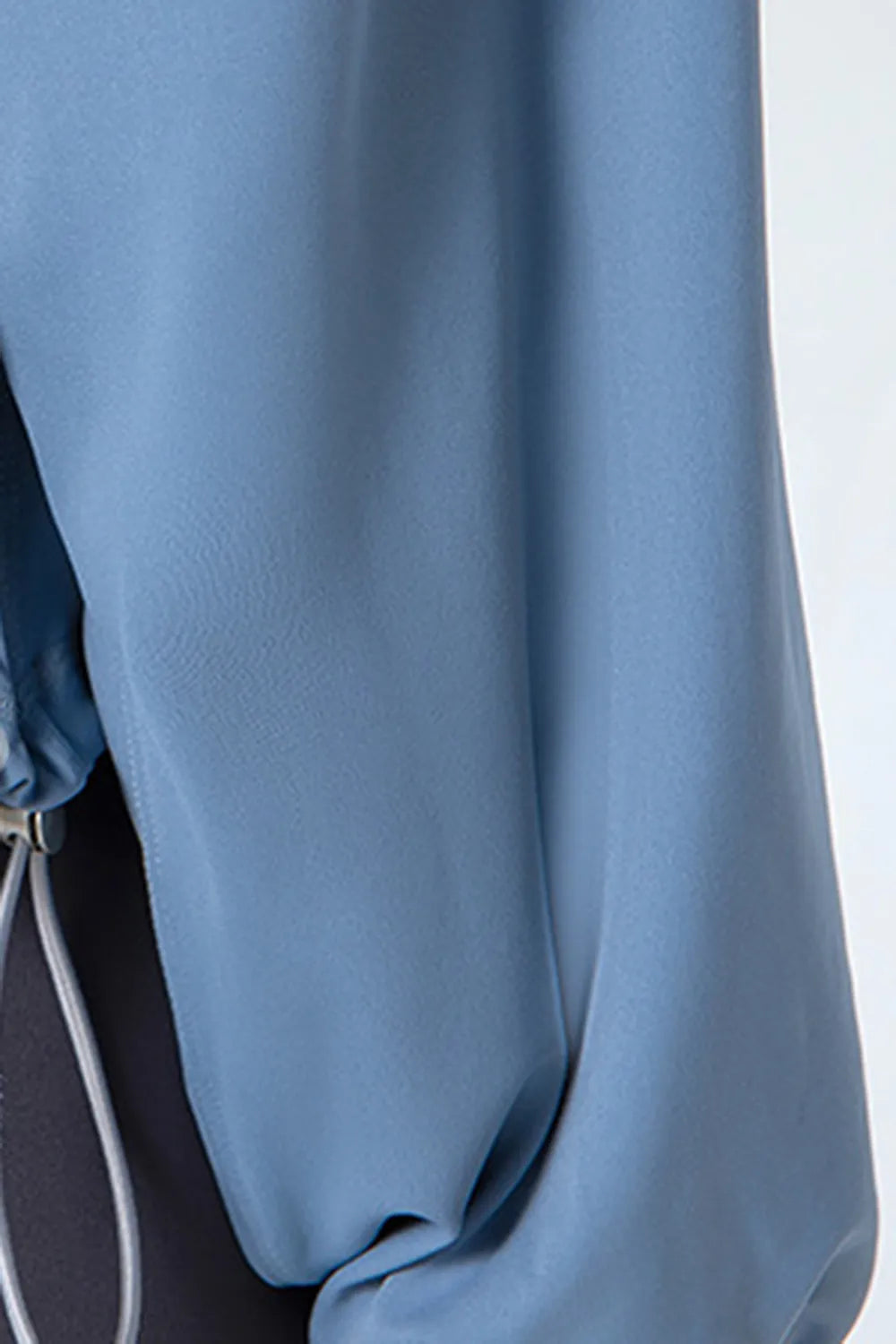 NEWYORKLISTED ACTIVEWEAR COLLECTION: Close-up of a blue garment with a blurred background