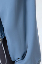 NEWYORKLISTED ACTIVEWEAR COLLECTION: Close-up of a blue garment with a blurred background