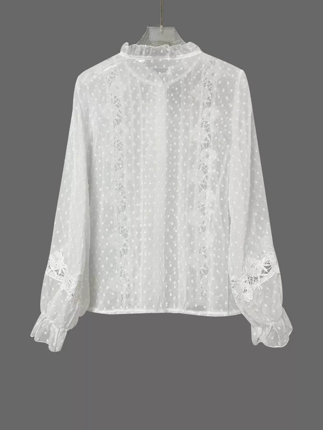 NEWYORKLISTED STYLE COLLECTION: White lace blouse on a gray background