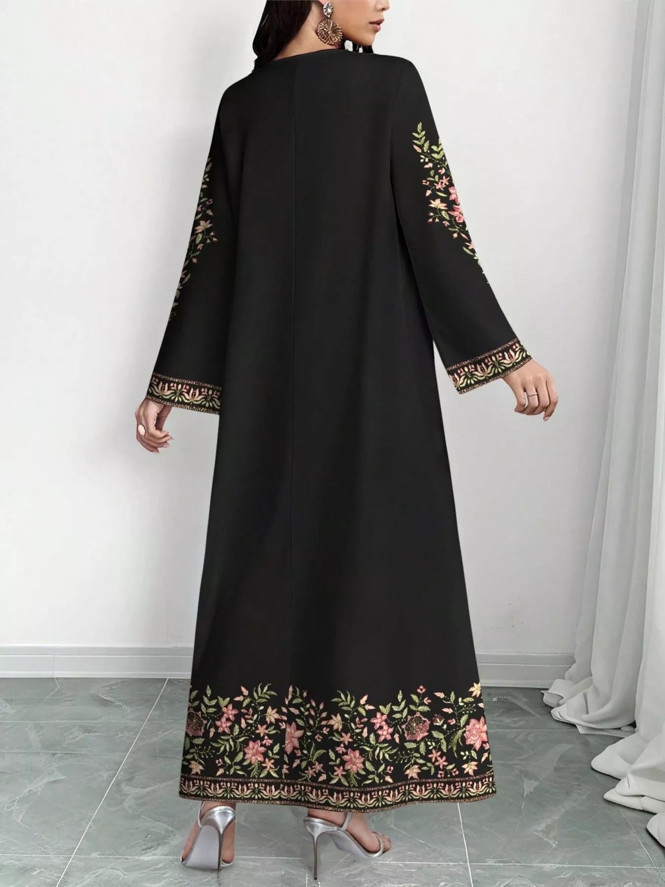 NEWYORKLISTED STYLE COLLECTION: Black dress with floral embroidery on a white background