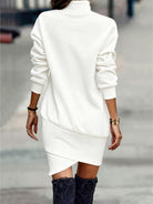 NEWYORKLISTED Style Collection: White turtleneck sweater dress worn by a person on a blurred street background