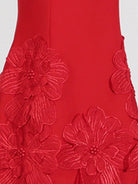 NEWYORKLISTED STYLE COLLECTION: Red fabric with floral embroidery on a white background