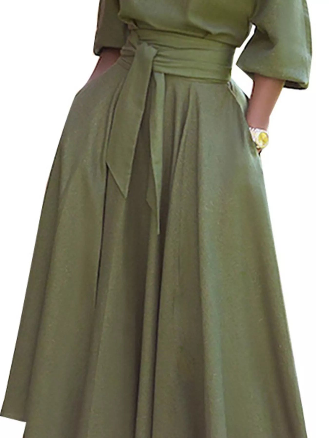 NEWYORKLISTED STYLE COLLECTION: Green dress with a belt on a white background