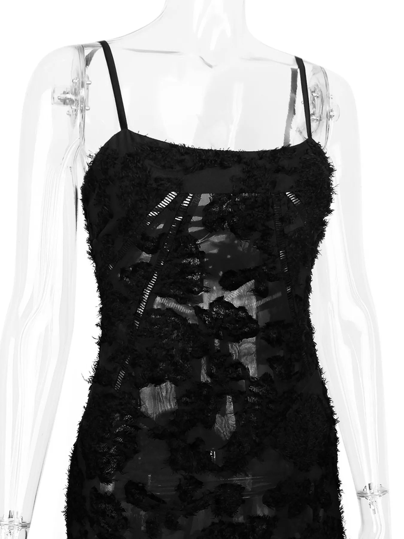 NEWYORKLISTED STYLE COLLECTION: Black lace dress on a mannequin against a white background