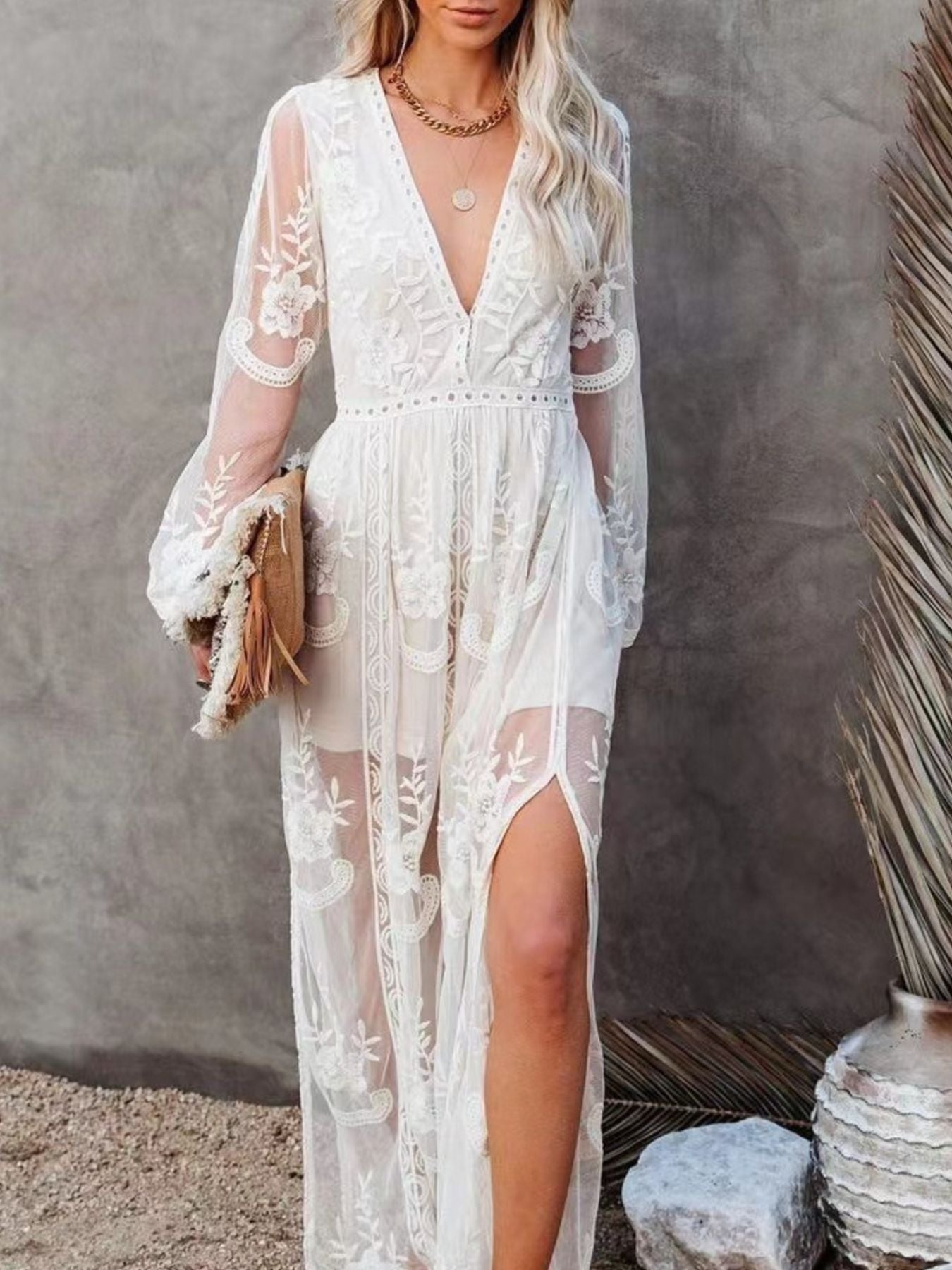 NEWYORKLISTED STYLE COLLECTION: Woman wearing a white lace dress with a gray background