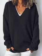NEWYORKLISTED STYLE COLLECTION V-Neck Dropped Shoulder Sweater in soft knit black fabric on a minimalist white background 