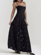 NEWYORKLISTED STYLE COLLECTION: Black lace dress worn by a model on a white background