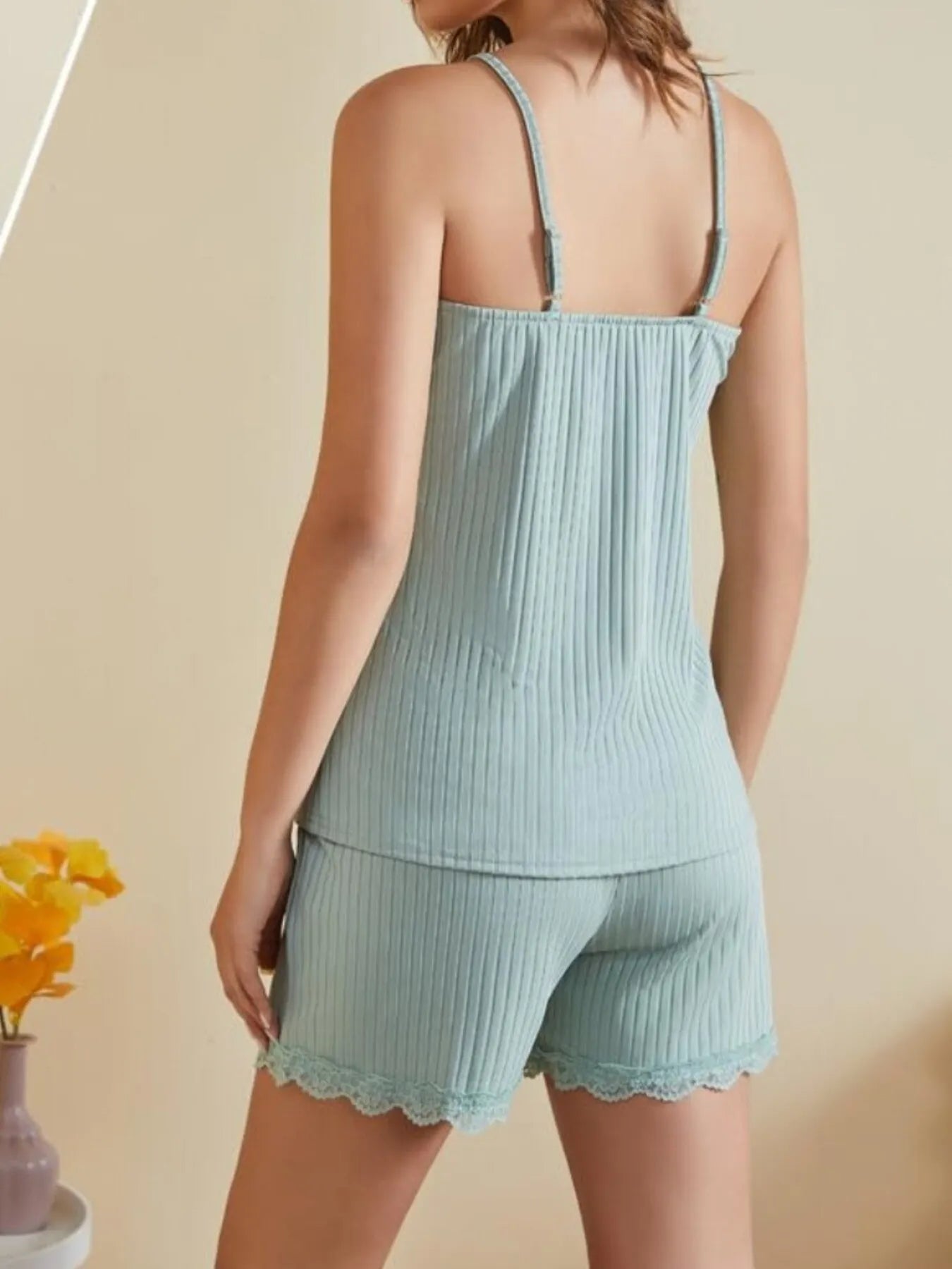 NEWYORKLISTED Intimate Apparel: Light blue ribbed pajama set with lace trim on a neutral background