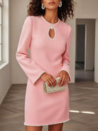 NEWYORKLISTED STYLE COLLECTION: Woman wearing a pink dress with pearl details, holding a silver clutch.