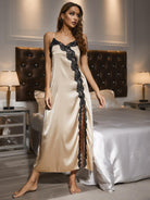 NEWYORKLISTED Intimate Apparel Collection: Woman in a beige satin nightgown with black lace trim standing in a bedroom.