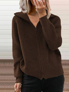 NEWYORKLISTED STYLE COLLECTION: Brown ribbed zip-up sweater worn by a person against a neutral background