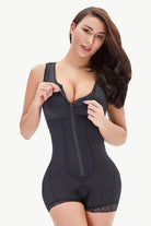 NEWYORKLISTED Intimate Apparel: Woman wearing a black shapewear bodysuit on a white background
