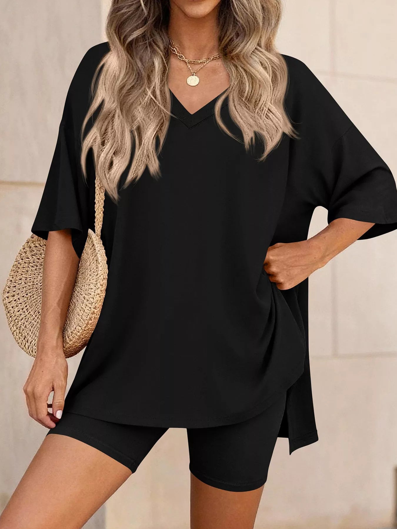NEWYORKLISTED COMFORT COLLECTION: Woman wearing a black outfit with a beige background