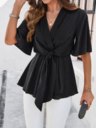 NEWYORKLISTED STYLE COLLECTION: Devine Tied Front Peplum Blouse in Black