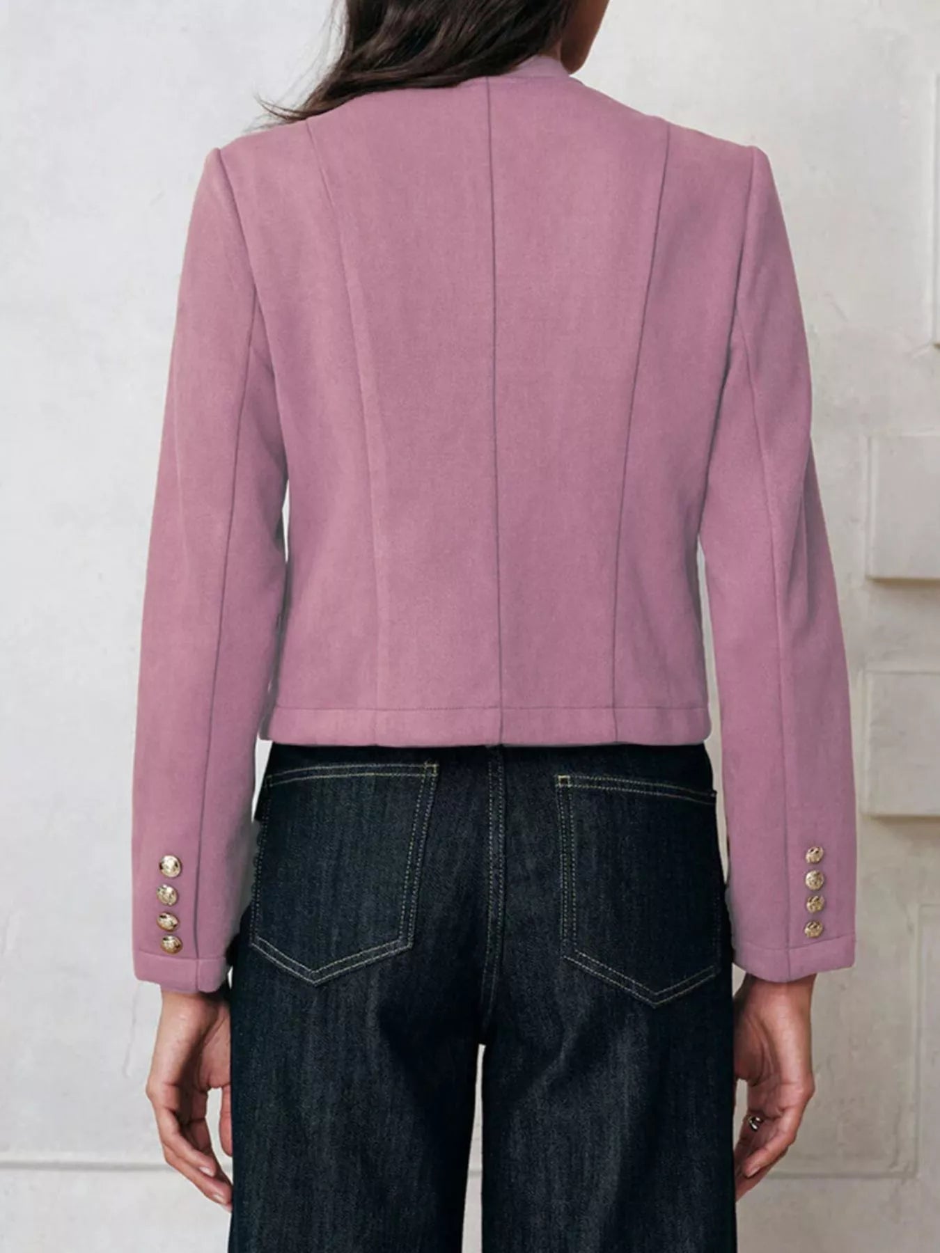 NEWYORKLISTED Style Collection Pink blazer with gold buttons worn by a person against a white background