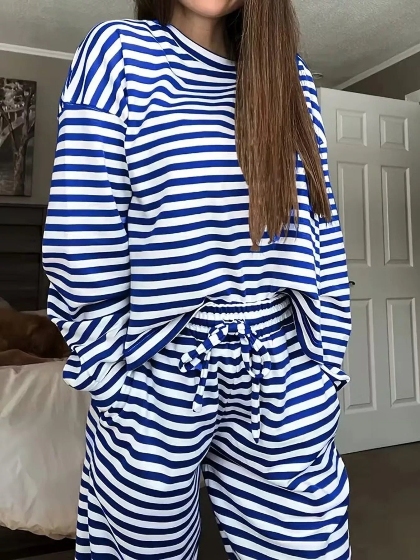 NEWYORKLISTED Comfort Collection: Person wearing a blue and white striped outfit in a room.