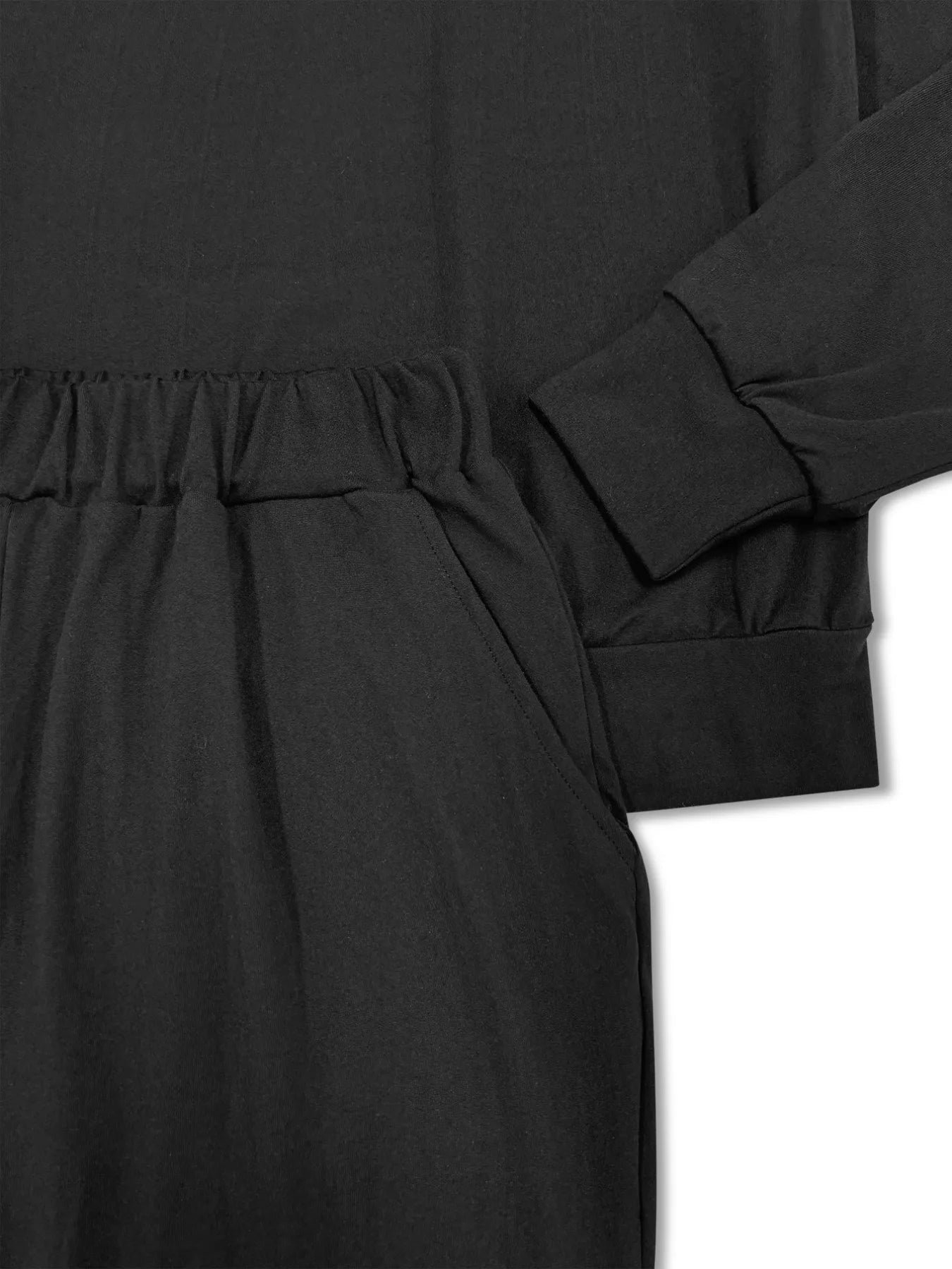 NEWYORKLISTED STYLE COLLECTION: Black dress with long sleeves on a white background