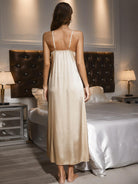 NEWYORKLISTED Intimate Apparel Collection: Woman in a beige satin nightgown standing in a bedroom.