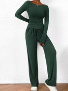 NEWYORKLISTED COMFORT COLLECTION: Long Sleeve Top and Wide Leg Pants Set: Green jumpsuit worn by a person against a white wall