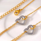 NEWYORKLISTED Valentine's Day Specials: Gold and silver heart-shaped clasp on a gold chain against a white background