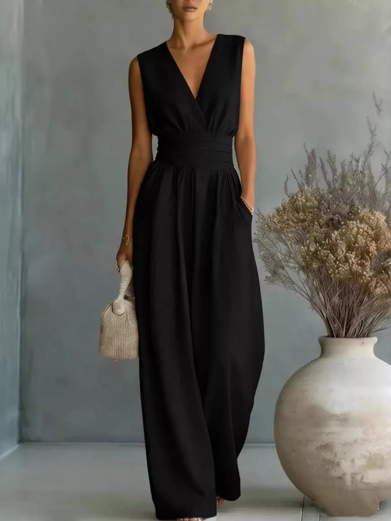 Model wearing the NEWYORKLISTED STYLE COLLECTION sleeveless wide leg jumpsuit with pockets, styled for comfortable everyday boutique fashion.