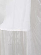 NEWYORKLISTED STYLE COLLECTION: White fabric with a subtle pattern on a plain background