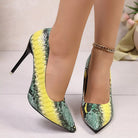 NEWYORKLISTED SHOE COLLECTION: Green and yellow snake print high heels on a neutral background