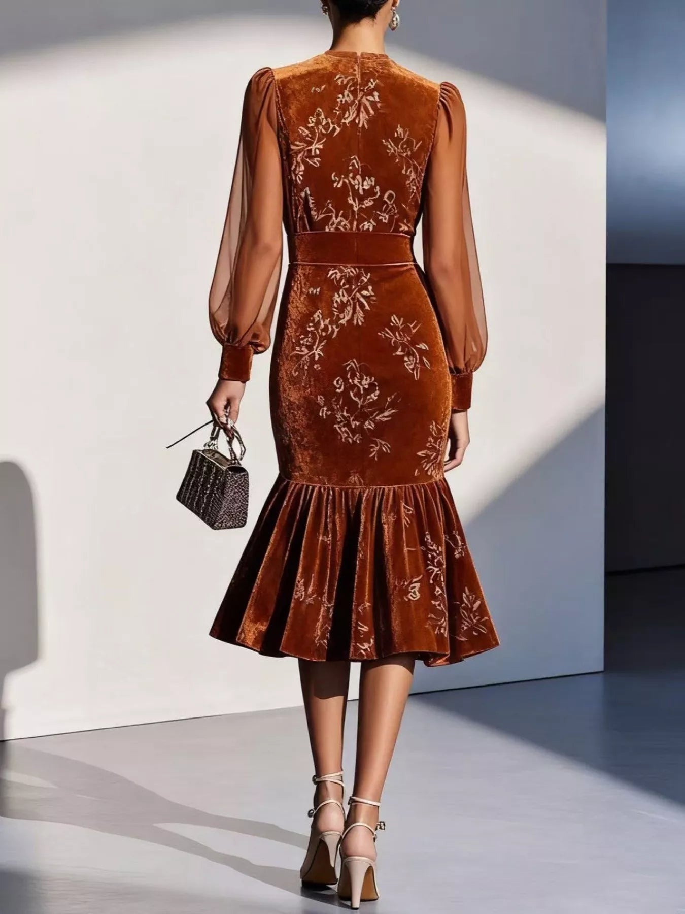 NEWYORKLISTED RUNWAY STYLE: Brown embroidered dress worn by a model against a white wall