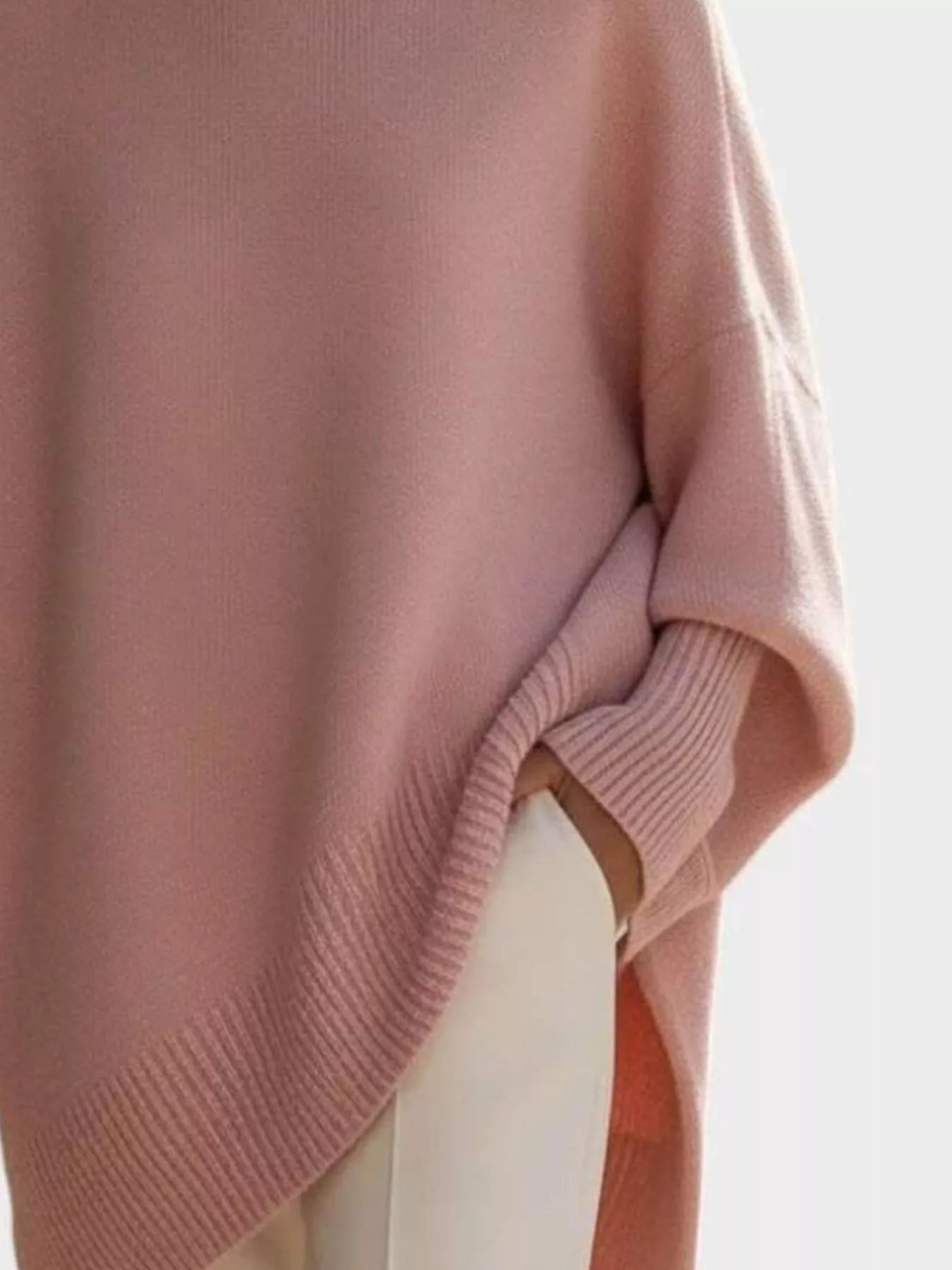 NEWYORKLISTED STYLE COLLECTION: Pink knit oversized sweater with a blurred background