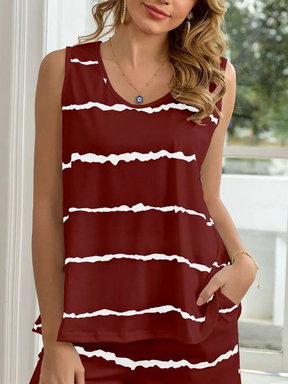 NEWYORKLISTED Intimate Apparel: Woman wearing a red and white striped dress indoors.