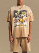 NEWYORKLISTED ATLAS MEN'S COLLECTION: Person wearing a beige t-shirt with graphic design and shorts on a beige background