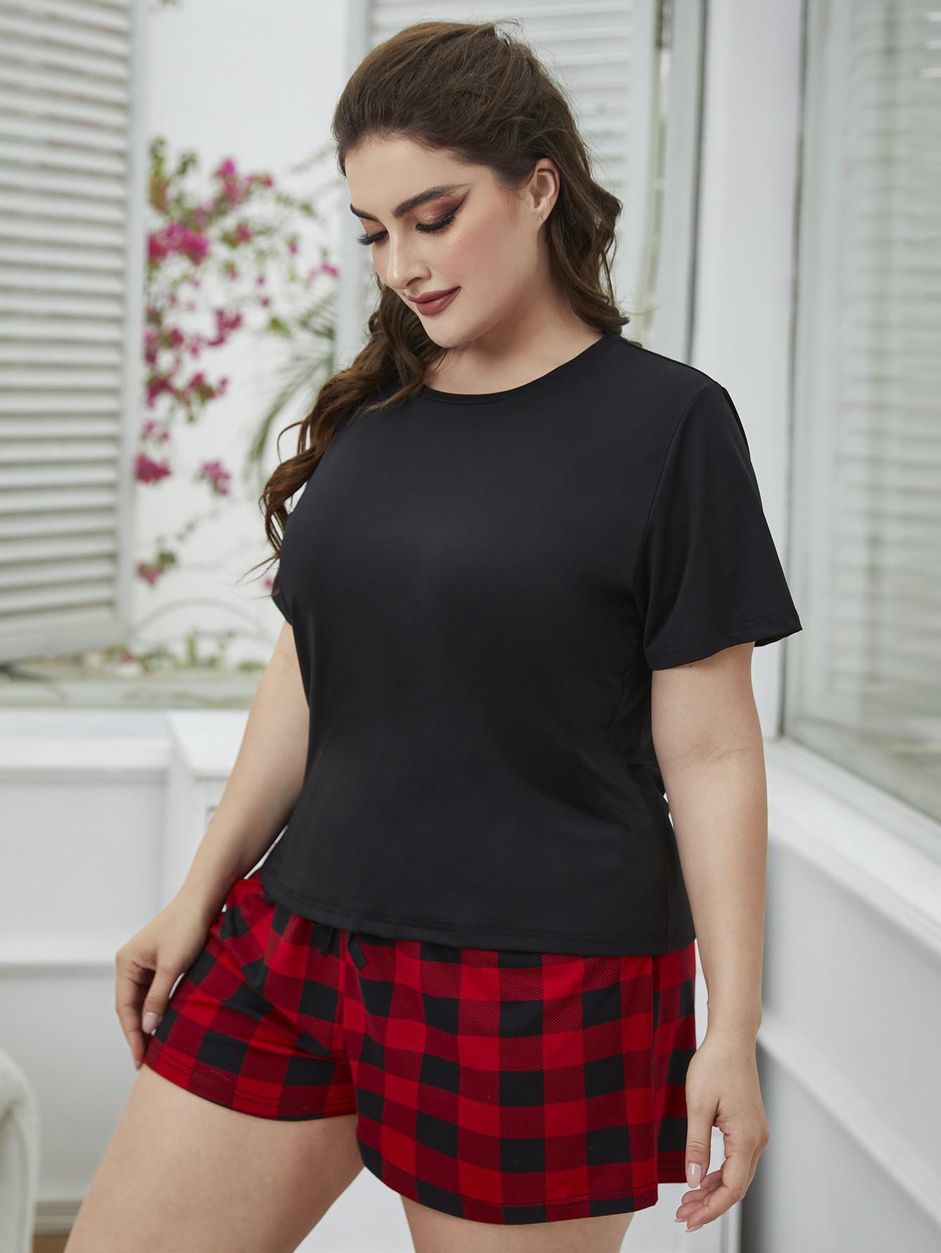 NEWYORKLISTED Intimate Apparel: Woman wearing a black t-shirt and red plaid shorts indoors.